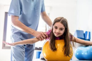 Child on stomach over therapy call in occupational therapy