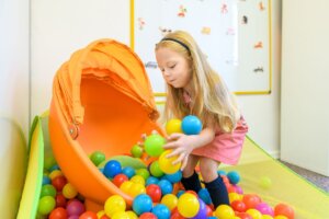 child with ball pit in occupational therapy